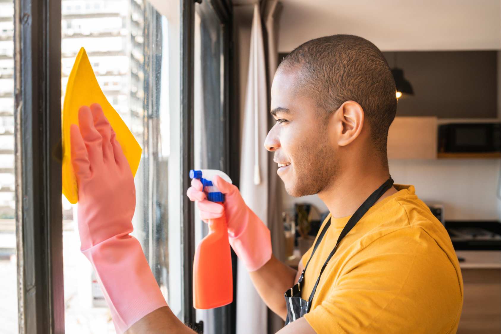 Cleaner washing a glass window